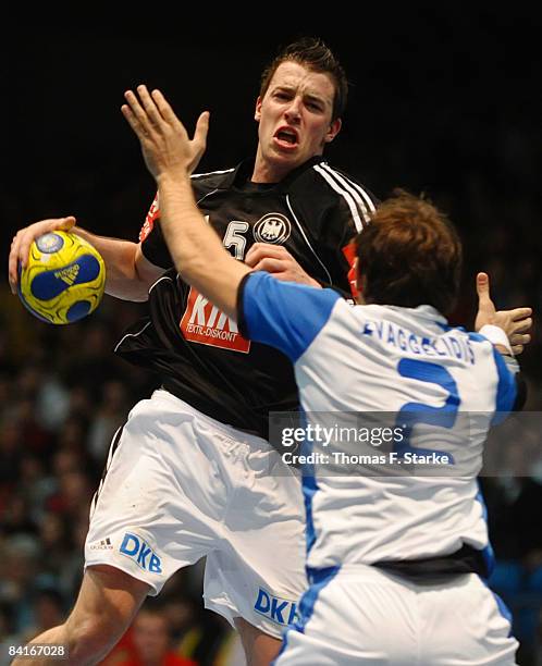 Dominik Klein of Germany and Theodoros Evaggelidis of Greece in action during the International Handball Friendly match between Germany and Greece at...