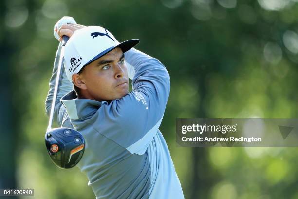 Rickie Fowler of the United States plays his shot from the 13th tee during round one of the Dell Technologies Championship at TPC Boston on September...