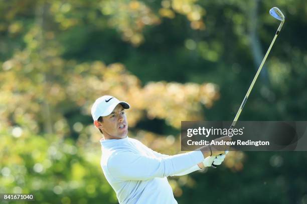 Rory McIlroy of Northern Ireland plays a shot on the 13th hole during round one of the Dell Technologies Championship at TPC Boston on September 1,...