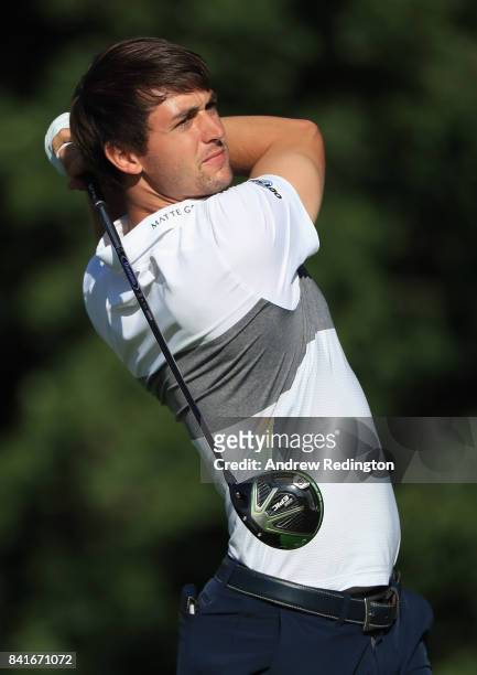 Ollie Schniederjans of the United States plays his shot from the 14th tee during round one of the Dell Technologies Championship at TPC Boston on...