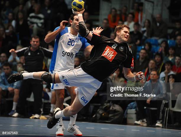 Sebastian Preiss of Germany and Savvas Karypidis of Greece in action during the International Handball Friendly match between Germany and Greece at...