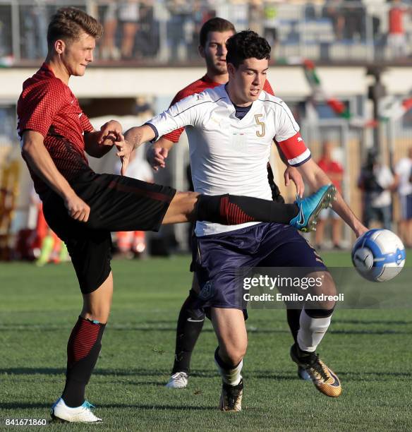 Alessandro Bastoni of Italy competes for the ball with Keskin Ramazan of Turkey during the U19 international friendly match between Italy U19 and...