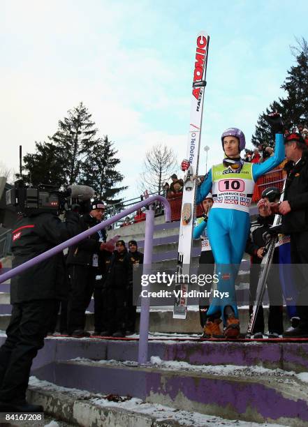 Martin Schmitt of Germany finishing third attends the victory ceremony after the FIS Ski Jumping World Cup at the 57th Four Hills Ski Jumping...