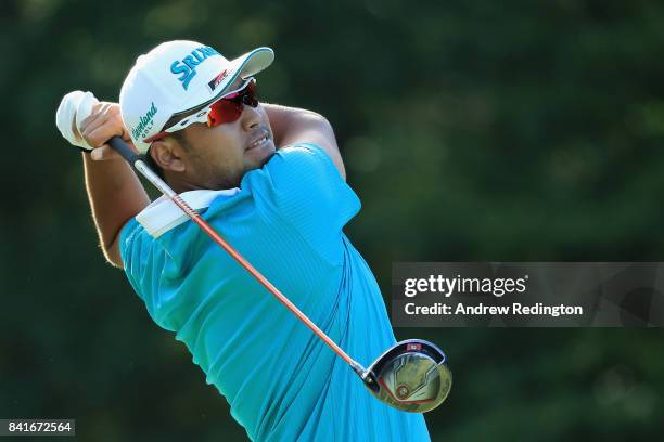 Hideki Matsuyama of Japan plays his shot from the 13th tee during round one of the Dell Technologies Championship at TPC Boston on September 1, 2017...