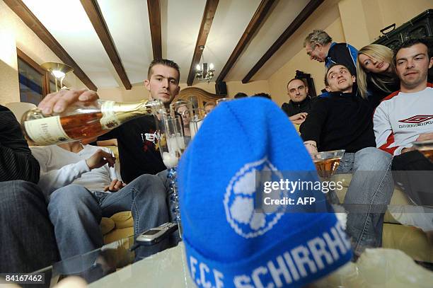 Schirrhein's players Jerome Lerche, Sylvain Kettering, Steve Heit and Maxime Balieux celebrate on January 4, 2009 in Schirrhein, their victory the...