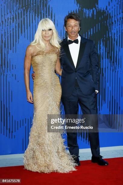 Donatella Versace and Pierpaolo Piccioli attend the The 1st Franca Sozzani Award during the 74th Venice Film Festival at Sala Giardino on September...