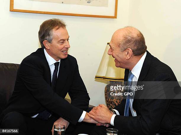 In this handout image supplied by the Israeli Government Press Office , Israeli Prime Minister Ehud Olmert shakes hands with Tony Blair, the EU's...