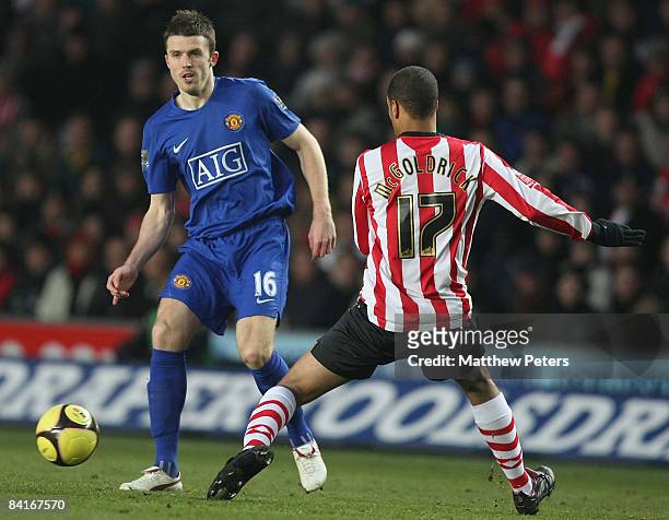 Michael Carrick of Manchester United clashes with David McGoldrick of Southampton during the FA Cup sponsored by e.on Third Round match between...