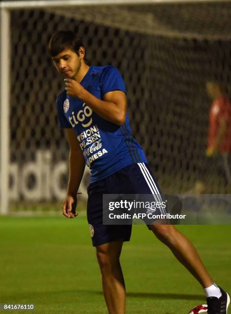 Paraguayan national football team player Oscar Romero takes part in a training session at the Complejo Albiroga training centre in Ypane, near...