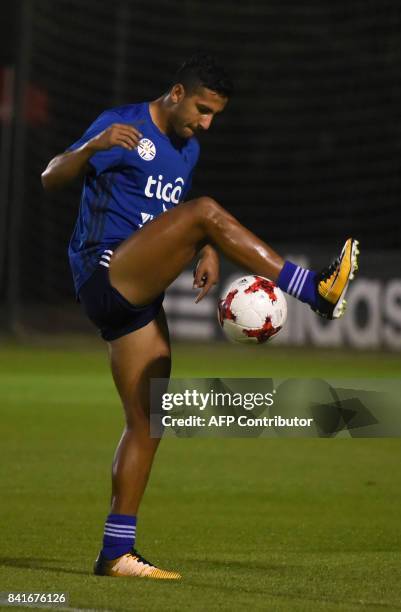 Paraguayan national football team player Cecilio Dominguez controls the ball during a training session at the Complejo Albiroga training centre in...