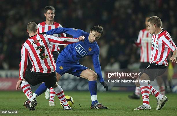 Dimitar Berbatov of Manchester United clashes with Chris Perry of Southampton during the FA Cup sponsored by e.on Third Round match between...