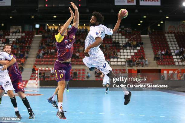 Arnaud Bingo of Montpellier Handball is shooting the ball against Kiril Lazarov of HBC Nantes during the Trophee des Champions Tournament match...