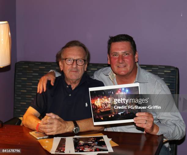 Tony Hadley looks at some archive images of himself shot in the 1980s with photographer Frank Griffin on August 31, 2017 in Los Angeles, California.