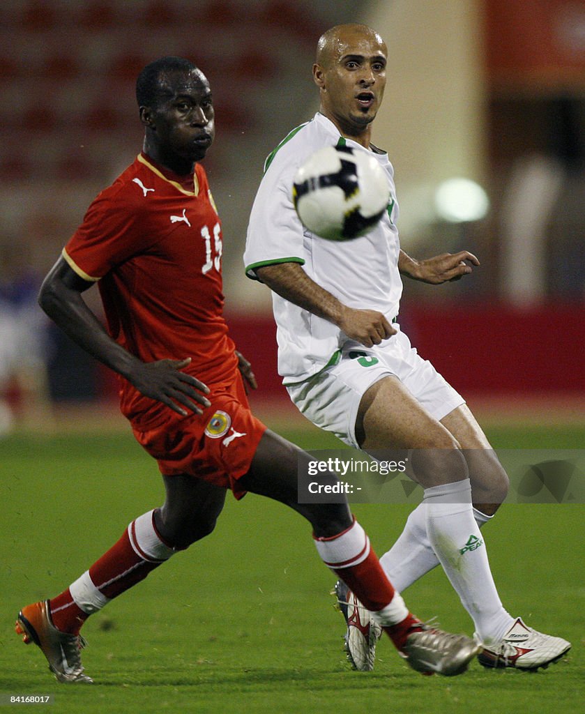 Abbas R Iraq's Bassem Abbas vies with Abdullah Omar of Bahrain during during ...