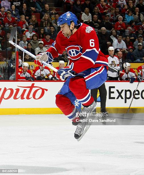 Tom Kostopoulos of the Montreal Canadiens leaps to avoid a shot while facing the Florida Panthers during their NHL game at the Bell Centre January 4,...