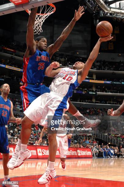Eric Gordon of the Los Angeles Clippers has his shot challenged by Amir Johnson of the Detroit Pistons at Staples Center on January 4, 2009 in Los...