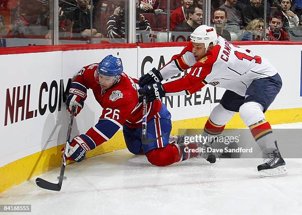 Gregory Campbell of the Florida Panthers checks Josh Gorges of the Montreal Canadiens during their NHL game at the Bell Centre January 4, 2009 in...