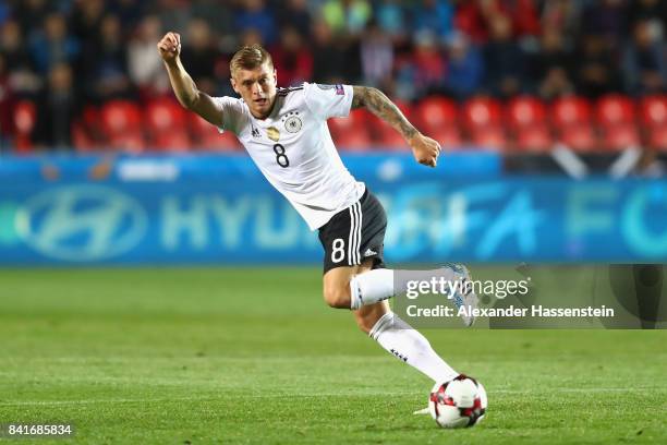 Toni Kroos of Germany runs with the ball during the FIFA World Cup Russia 2018 Group C Qualifier between Czech Republic and Germany at Eden Arena on...