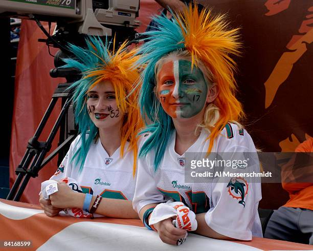 Fans of the Miami Dolphins watch play against the Baltimore Ravens during their AFC Wild Card Game at Dolphins Stadium on January 4, 2009 in Miami,...