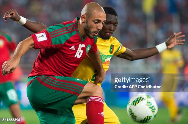 Morocco's Amrabet Noureddine vies for the ball with Mali's Hamari Traore during the Morocco vs Mali qualification match for the Fifa World Cup Russia...