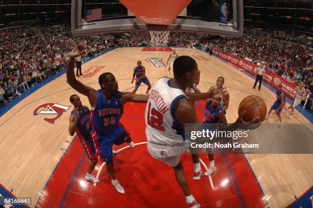 Al Thornton of the Los Angeles Clippers makes a pass against the defense of Antonio McDyess of the Detroit Pistons during their game at Staples...