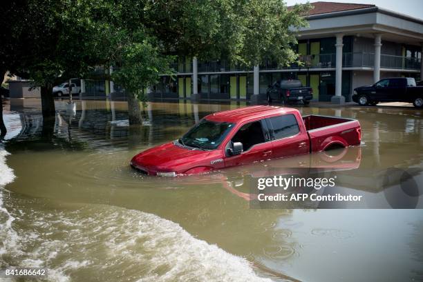 Water damage from a flooded home in Port Arthur, Texas, on Thursday, September 1 2017. Storm-weary residents of Houston and other Texas cities began...