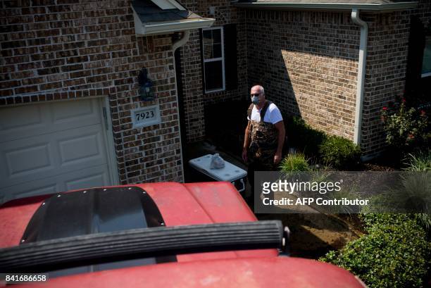 Doug Lablanc outside his father's flooded home in Port Arthur, Texas, on Thursday, September 1, 2017. Storm-weary residents of Houston and other...