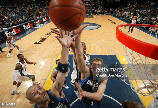 Jason Kidd and Dirk Nowitzki of the Dallas Mavericks grabs a rebound over Darrell Arthur of the Memphis Grizzlies on January 4, 2009 at FedExForum in...