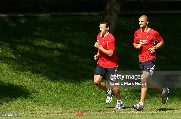 Jared Crouch and Nic Malceski run during the Sydney Swans AFL training session at Sydney Grammar School on January 5, 2009 in Sydney, Australia. The...