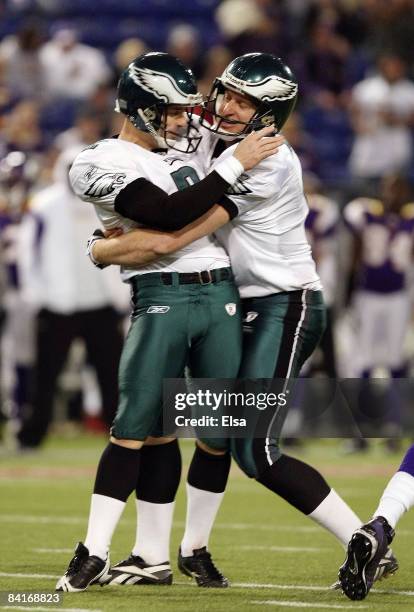 David Akers of the Philadelphia Eagles and Sav Rocca celebrate after Akers kicked a field goal late in the fourth quarter against the Minnesota...