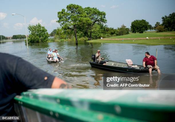 Rescue teams help flood victims in a residential neighborhood in Port Arthur, Texas, on Thursday, September 1, 2017. Storm-weary residents of Houston...