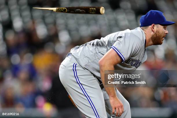 Starting pitcher Joe Biagini of the Toronto Blue Jays ducks before being hit with the shattered bat of Chris Davis of the Baltimore Orioles during...