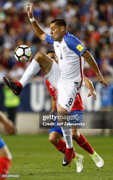 Clint Dempsey of the United States fights for the ball with David Guzman of Costa Rica during their match at Red Bull Arena on September 1, 2017 in...