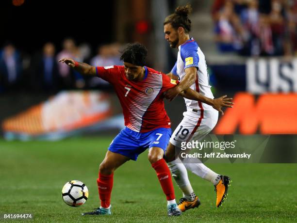 Cristian Bolanos of Costa Rica fights for the ball with Graham Zusi of the United States during their match at Red Bull Arena on September 1, 2017 in...