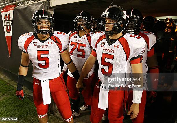 Matt Barkley and linebacker Manti Teo of the white team lead their team onto the field before the All America Under Armour Footbal Game at Florida...