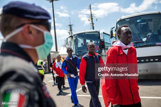 African migrants are transferred to reception centers after landed in the port of Salerno aboard the "Aquarius" ship of the Ngo "SOS Mediterranee" on...