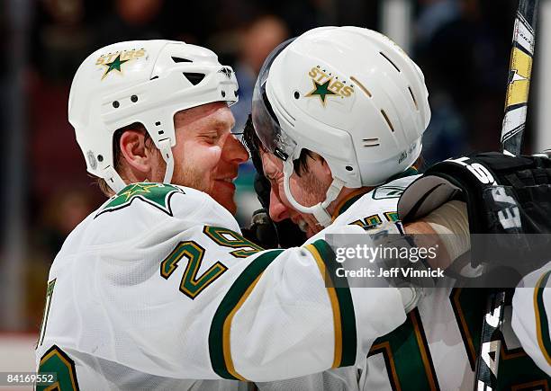 James Neal of the Dallas Stars is congratulated by teammate Steve Ott after scoring the shootout winning goal against the Vancouver Canucks at...