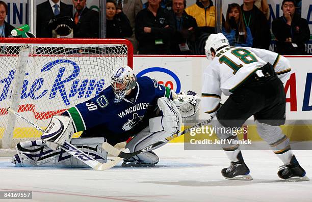 James Neal of the Dallas Stars scores the shootout winning goal against Jason LaBarbera of the Vancouver Canucks at General Motors Place on January...