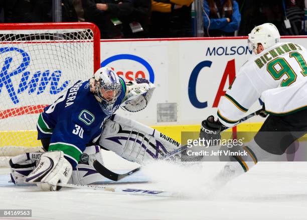 Jason LaBarbera of the Vancouver Canucks makes a save off the shot of Brad Richards of the Dallas Stars during their game at General Motors Place on...