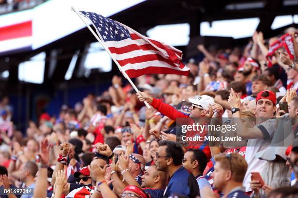 Fan waves an American flag before the game between the United States and Costa Rica during the FIFA 2018 World Cup Qualifier at Red Bull Arena on...