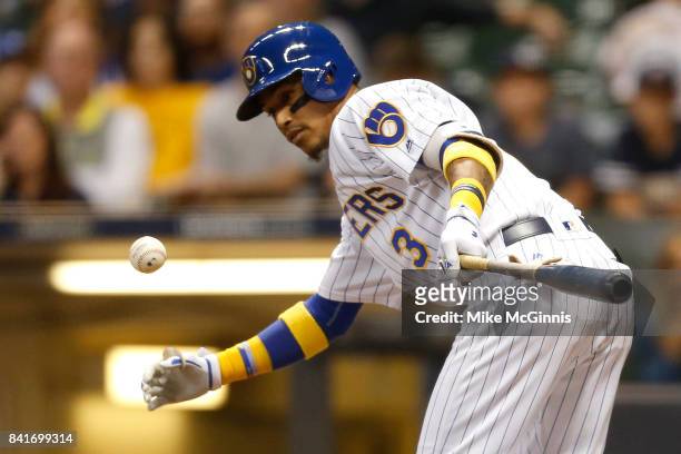 Jonathan Villar of the Milwaukee Brewers grounds into a double play during the fifth inning against the Washington Nationals at Miller Park on...