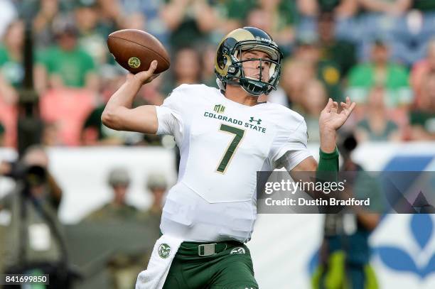 Quarterback Nick Stevens of the Colorado State Rams passes against the Colorado Buffaloes in the first half of a game at Sports Authority Field at...