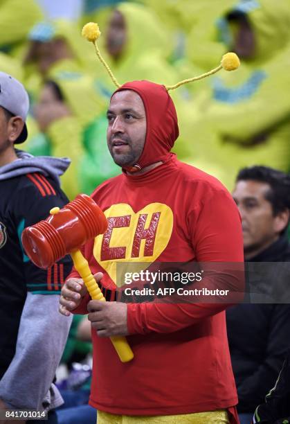 Fans of Mexico cheer for their team during their FIFA World Cup 2018 CONCACAF qualifiers football match against Panama, in Mexico City, on September...