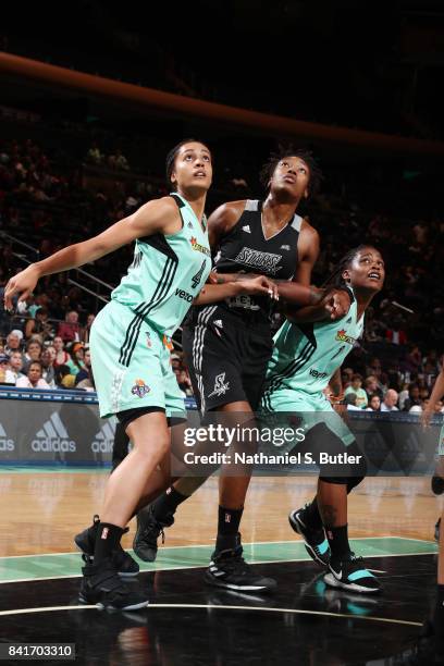 Nayo Raincock-Ekunwe and Shavonte Zellous of the New York Liberty box out Kayla Alexander of the San Antonio Stars on September 1, 2017 at Madison...