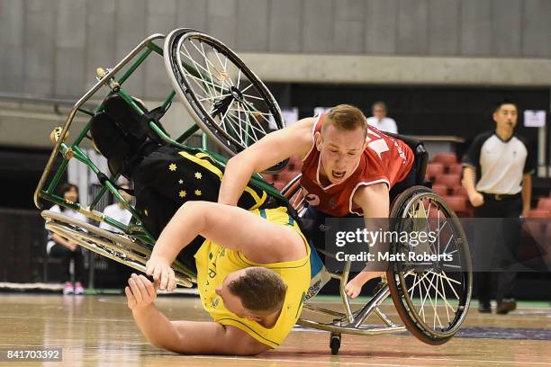 Shaun Norris of Australia and Gregg Warburton of Great Britain collide during the Wheelchair Basketball World Challenge Cup final between Australia...