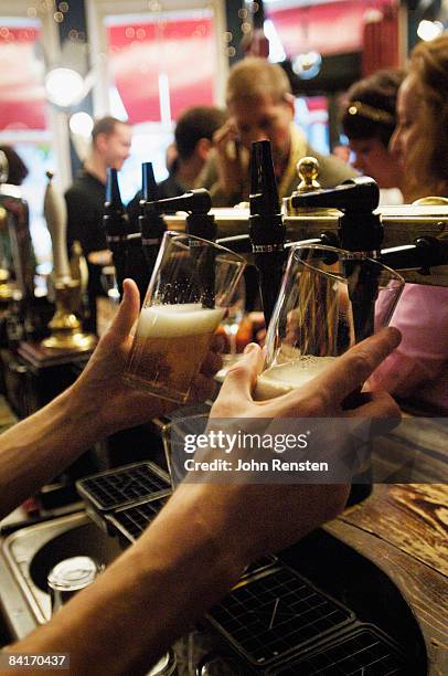 riotous drinking party in public bar  - british pub stock-fotos und bilder