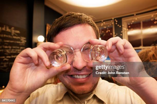 riotous drinking party in public bar  - tipsy stock pictures, royalty-free photos & images