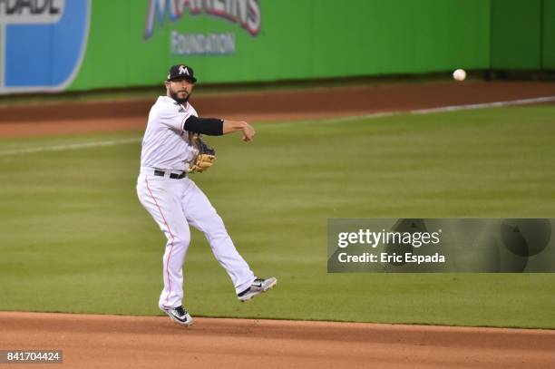 Mike Aviles of the Miami Marlins throws towards second base during the seventh inning against the Philadelphia Phillies at Marlins Park on September...