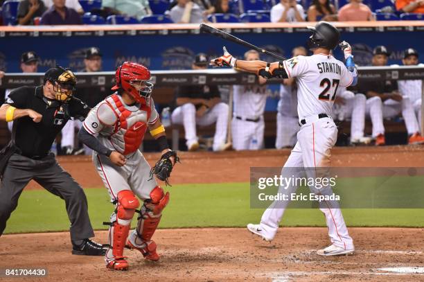 Giancarlo Stanton of the Miami Marlins reacts after being called out on strikes in the fifth inning against the Philadelphia Phillies at Marlins Park...