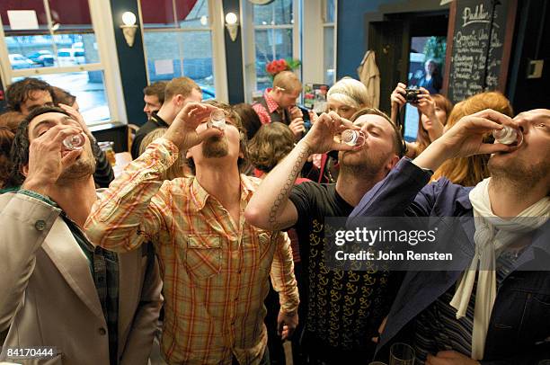 riotous drinking party in public bar  - betrunken stock-fotos und bilder